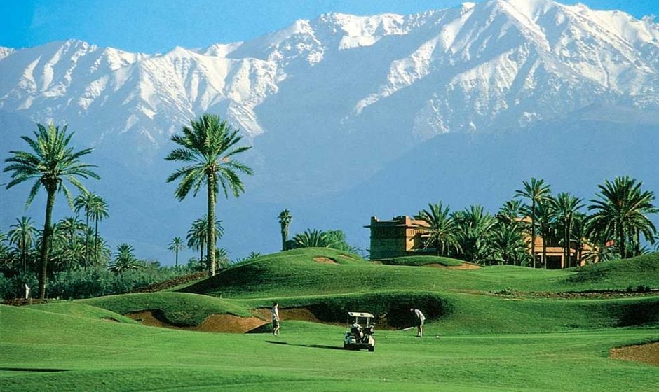 Golf course in morocco with mountains in background